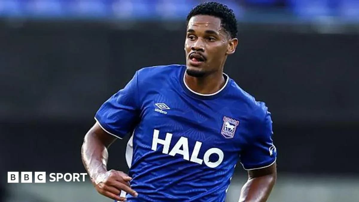 Player in blue jersey running on the field