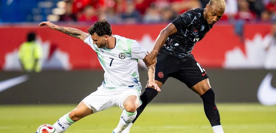 Player tackling opponent during a soccer match