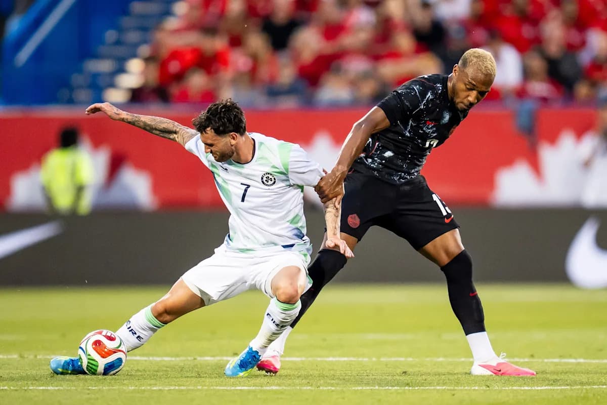 Player tackling opponent during a soccer match