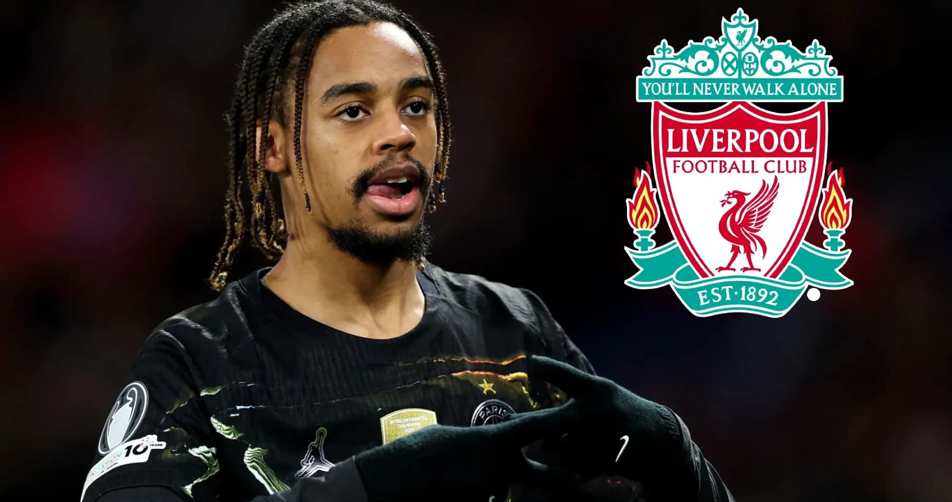 Player gesturing during match with Liverpool logo