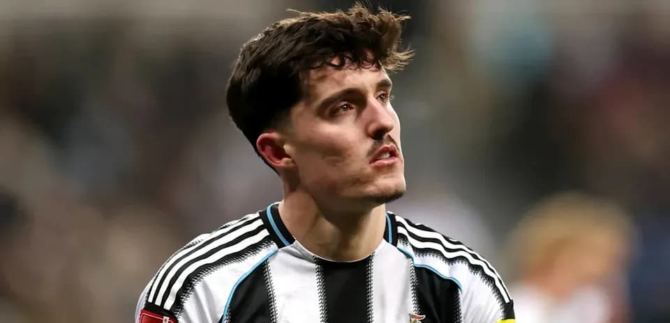 Newcastle player in home kit during match