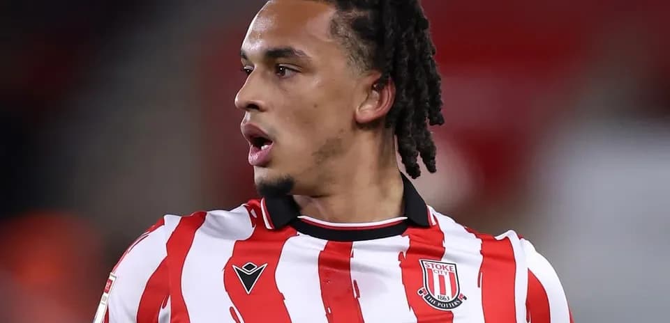 Stoke City player in red and white striped jersey