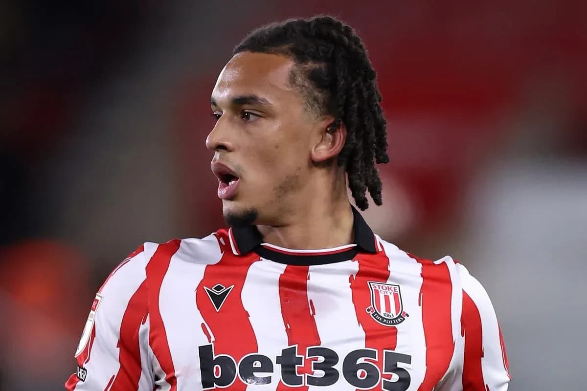 Stoke City player in red and white striped jersey