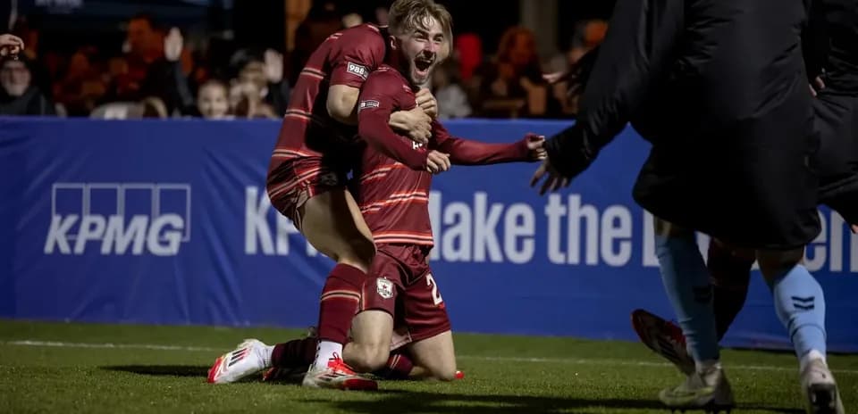 Players celebrating a goal during USL Championship match
