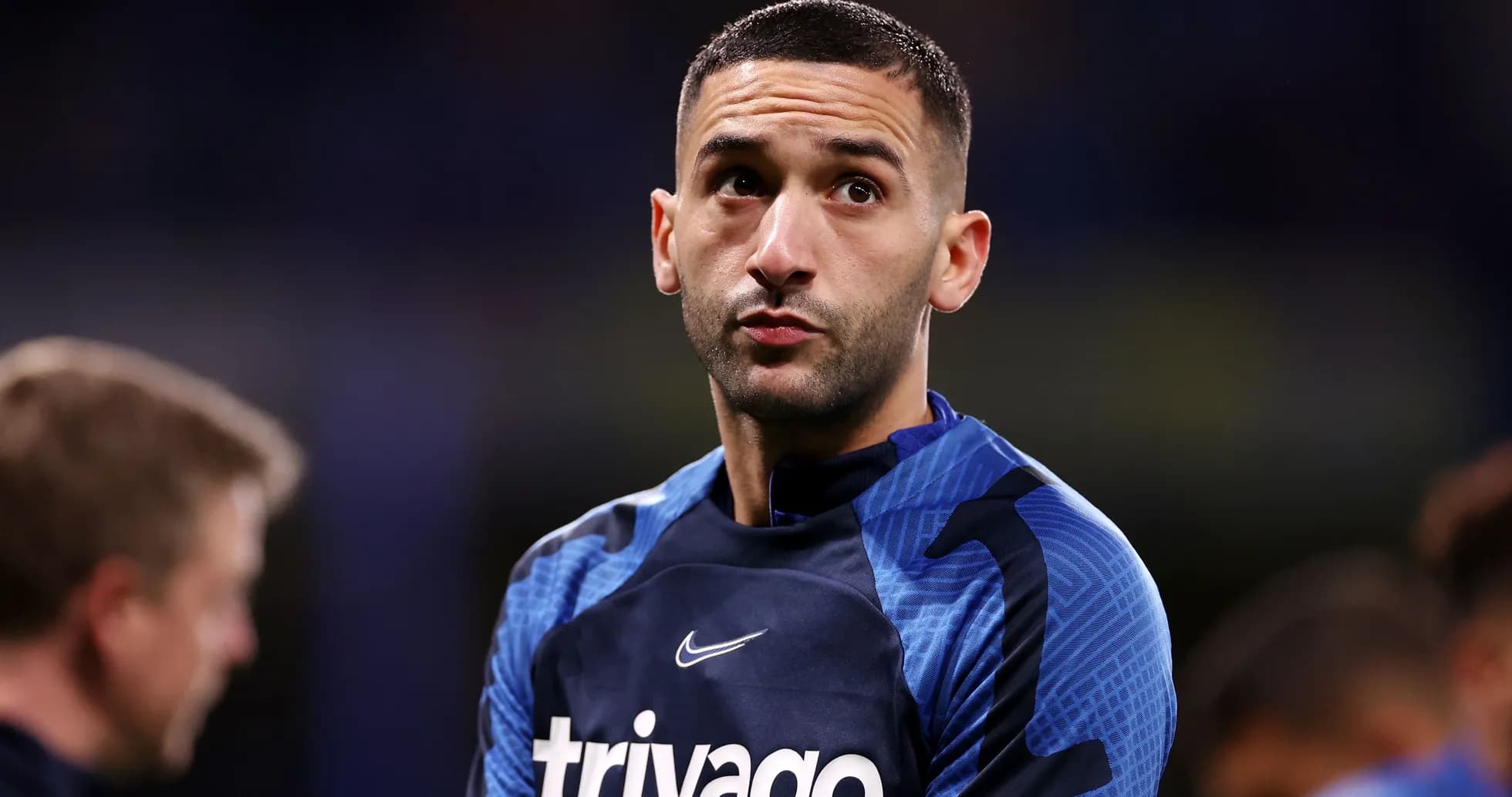 Player in blue training gear during warm-up session
