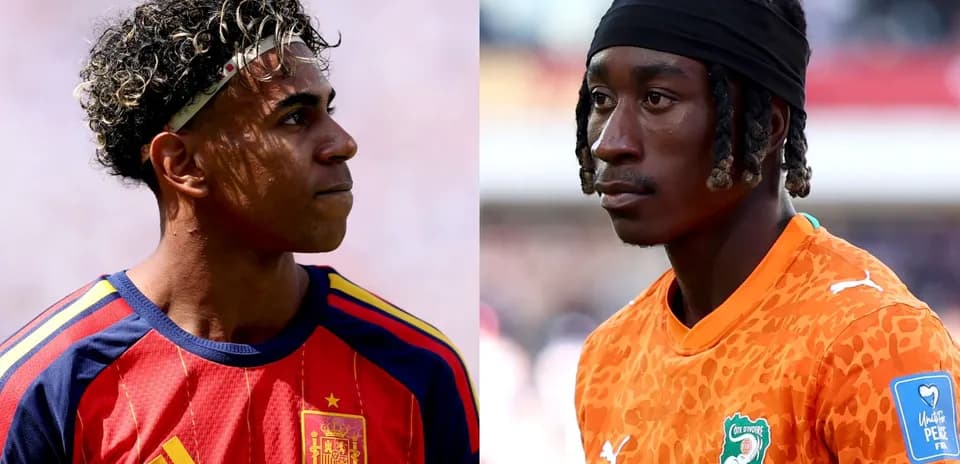 Two football players in national team jerseys