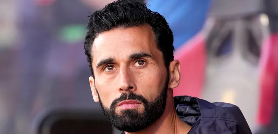 Player on bench during match with focused expression