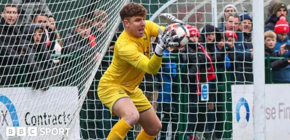 Goalkeeper making a save during a match
