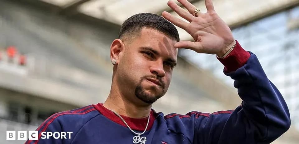 Player waving during a training session at stadium