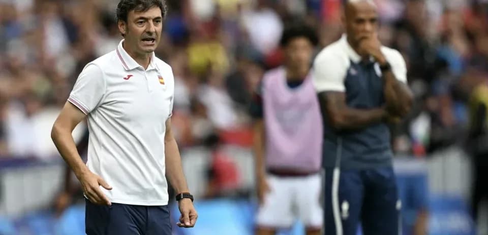 Coach giving instructions during a football match