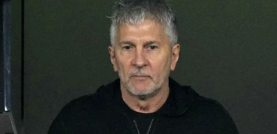 Man with gray hair in a black jacket