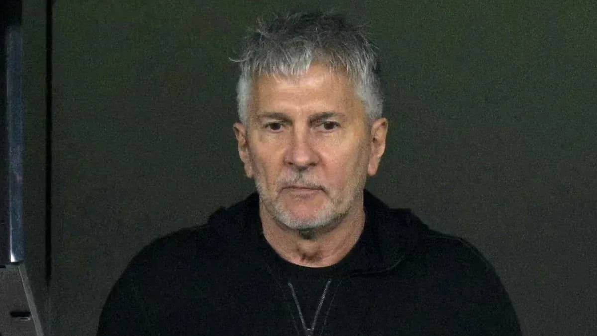 Man with gray hair in a black jacket