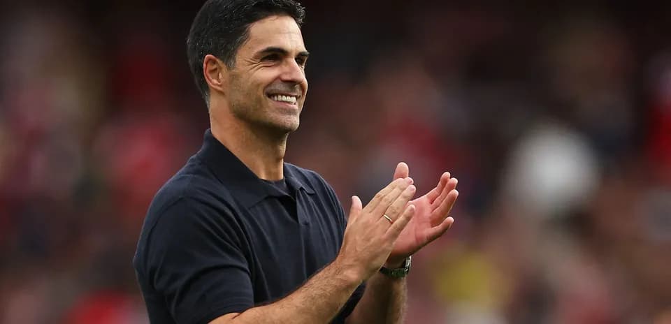 Manager applauding during a match on the sidelines