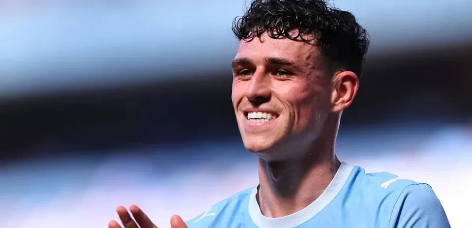 Player smiling and applauding after match