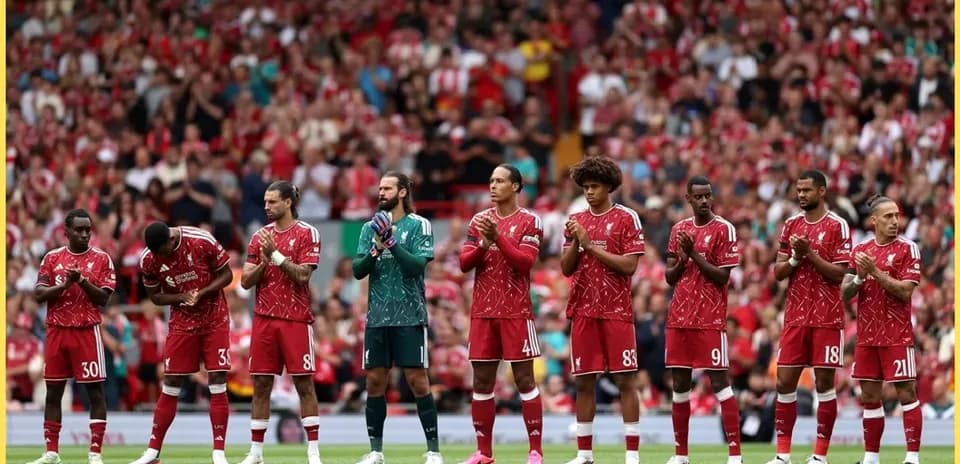 Liverpool players standing in line at Anfield