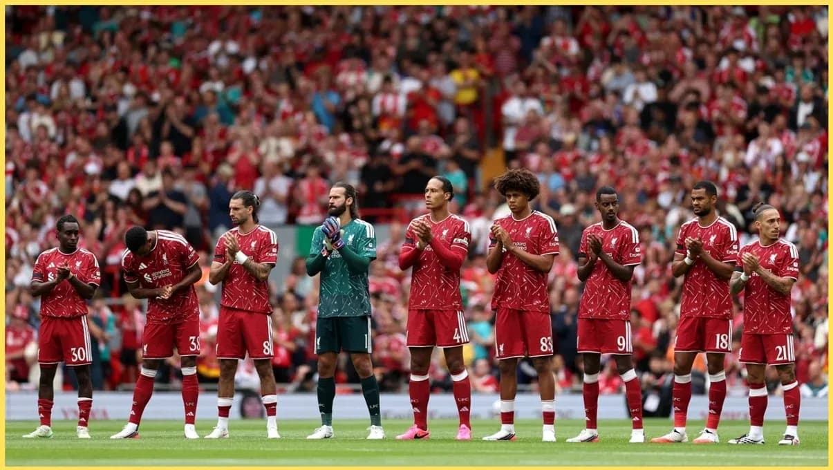 Liverpool players standing in line at Anfield