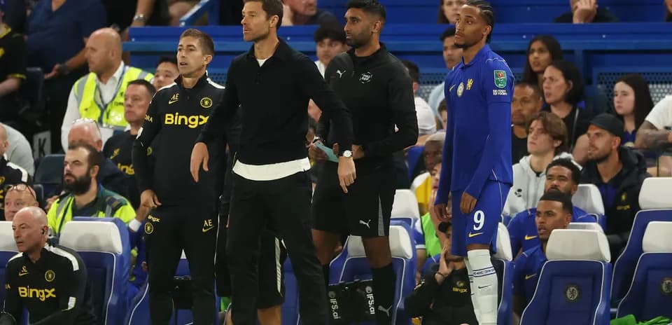 Coaches and players on the bench during match