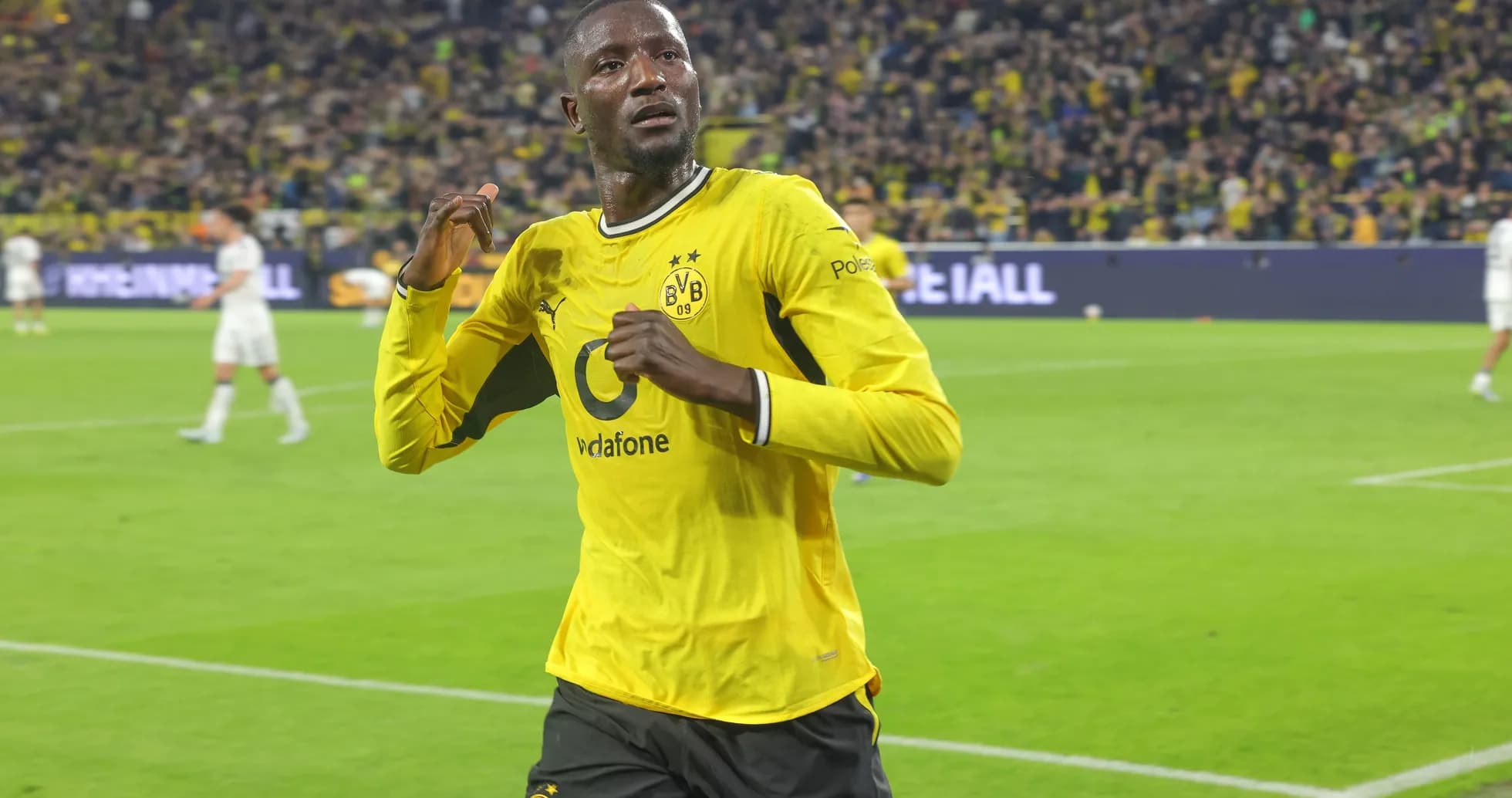 Player celebrating after scoring a goal for Borussia Dortmund