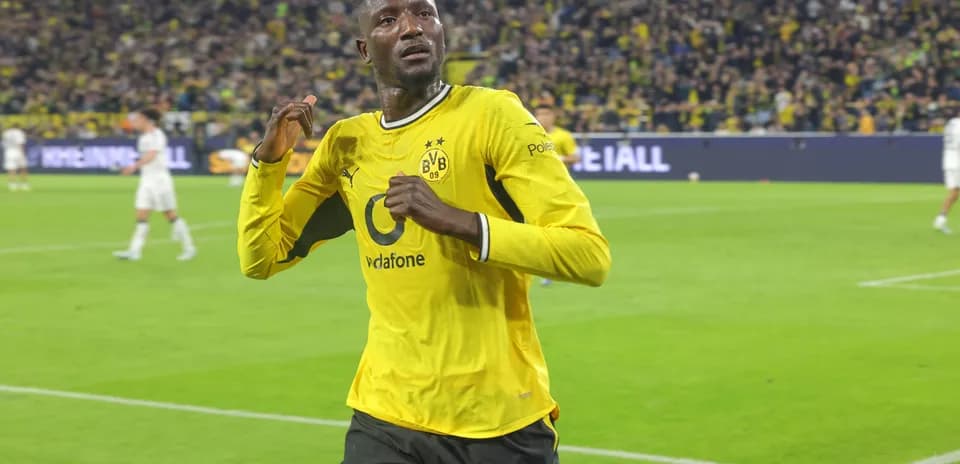 Player celebrating after scoring a goal for Borussia Dortmund