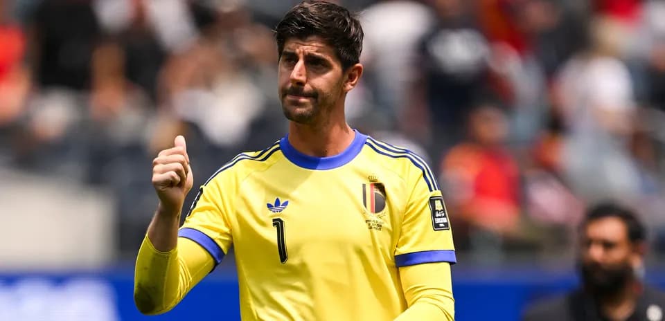 Goalkeeper in yellow jersey signaling during match