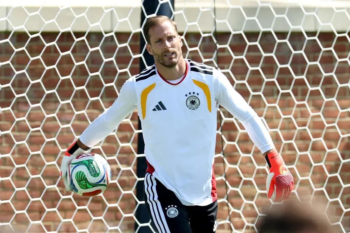 Goalkeeper training with ball near goal net