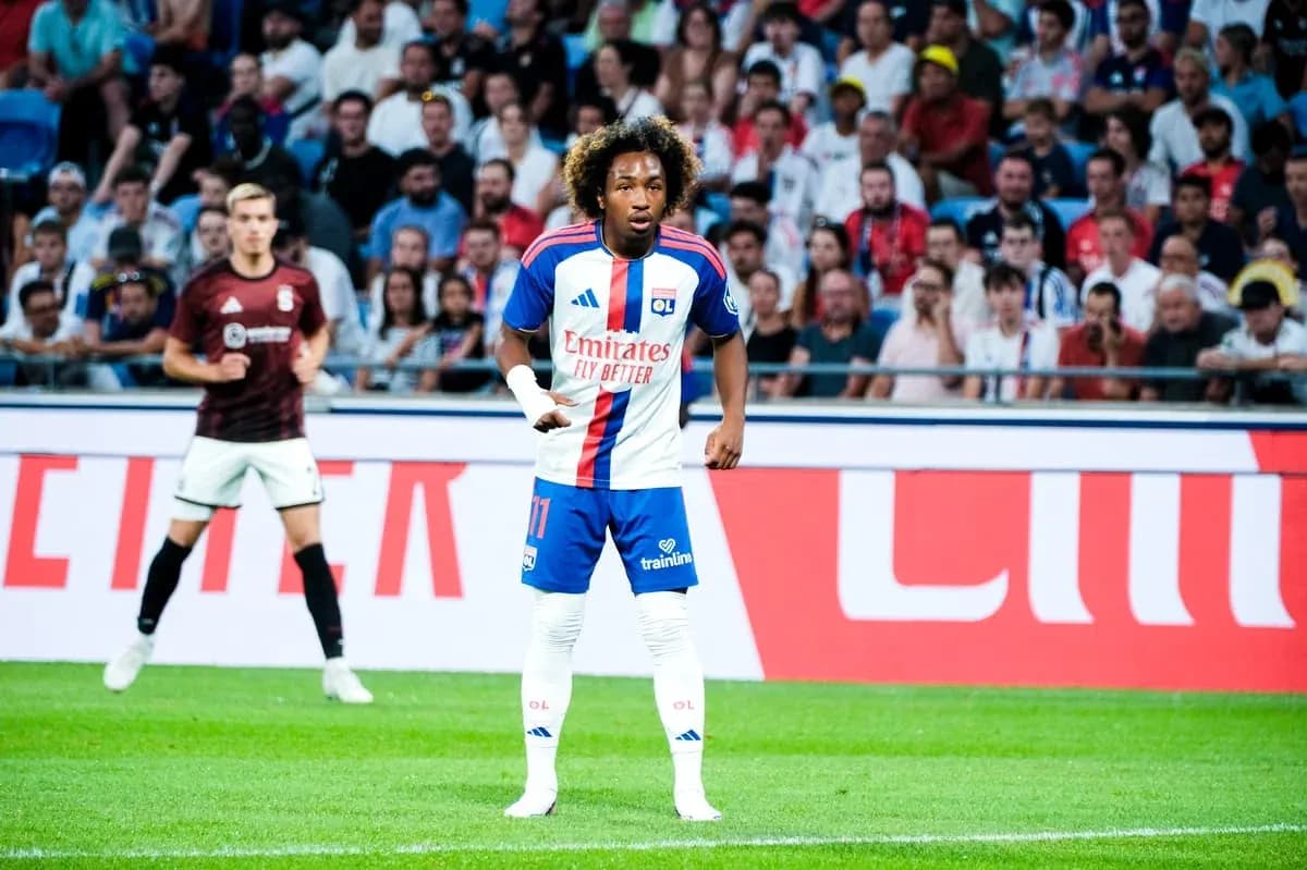Player wearing Olympique Lyonnais jersey during match