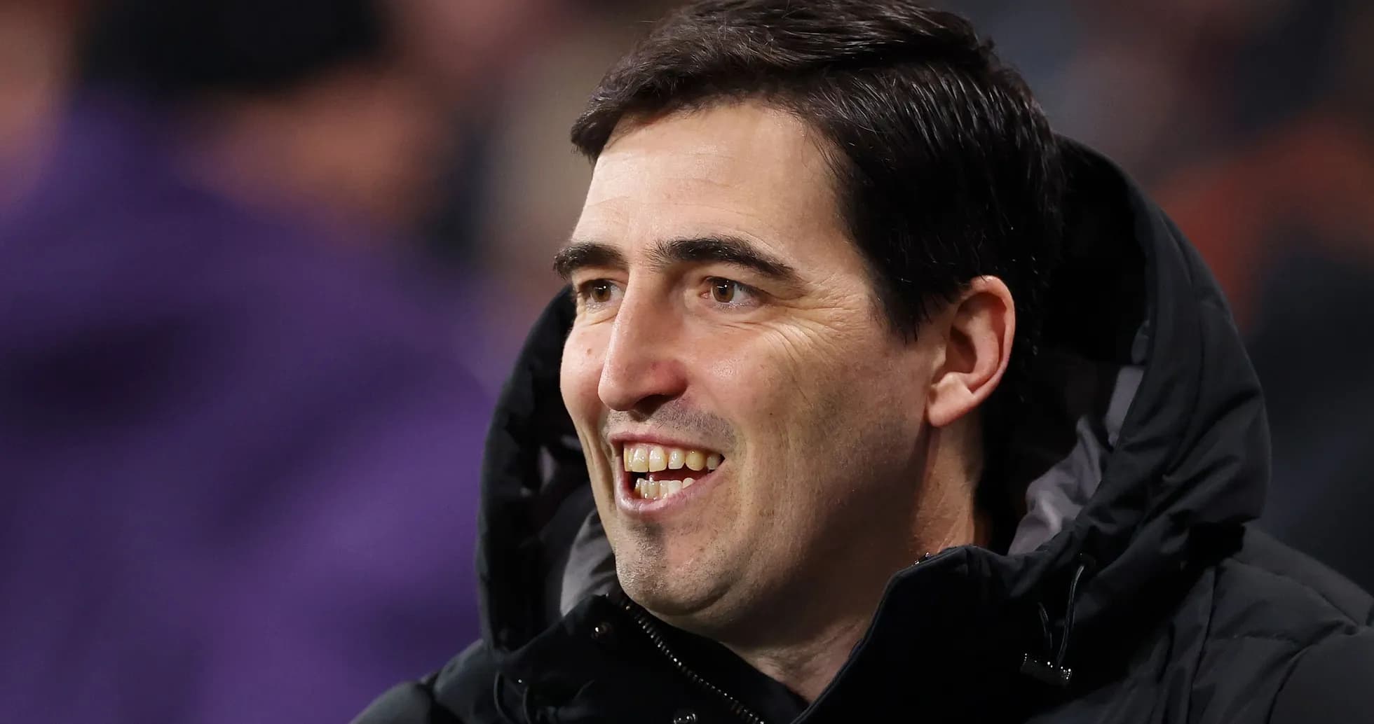 Coach smiling during a football match