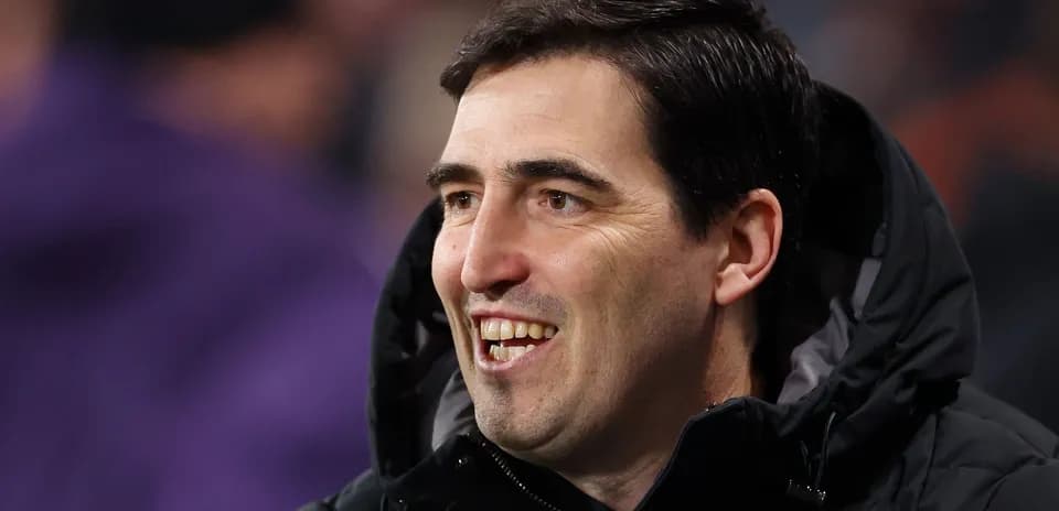Coach smiling during a football match