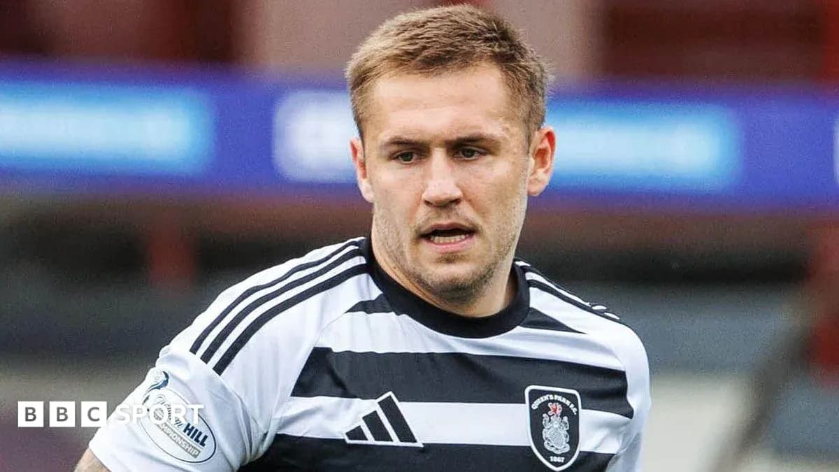 Player in striped football kit during match