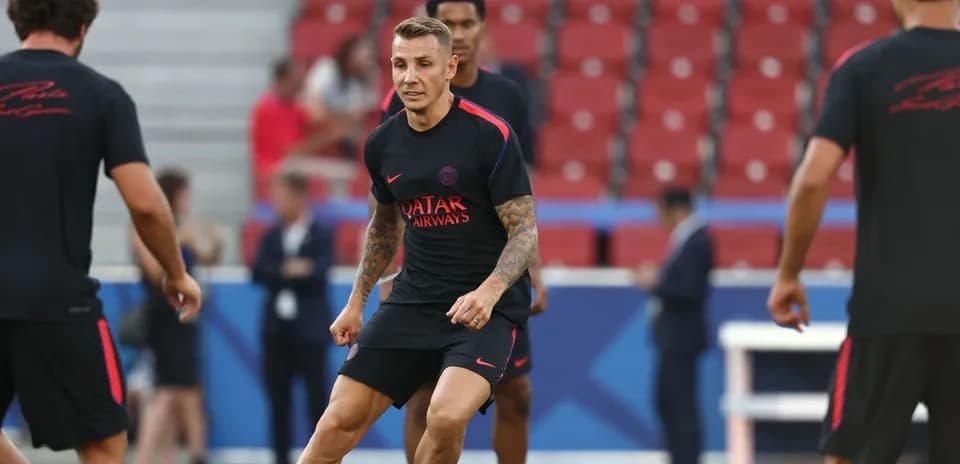 Player training during warm-up session on pitch