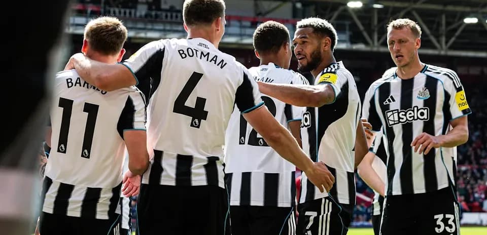 Newcastle United players celebrating a goal together