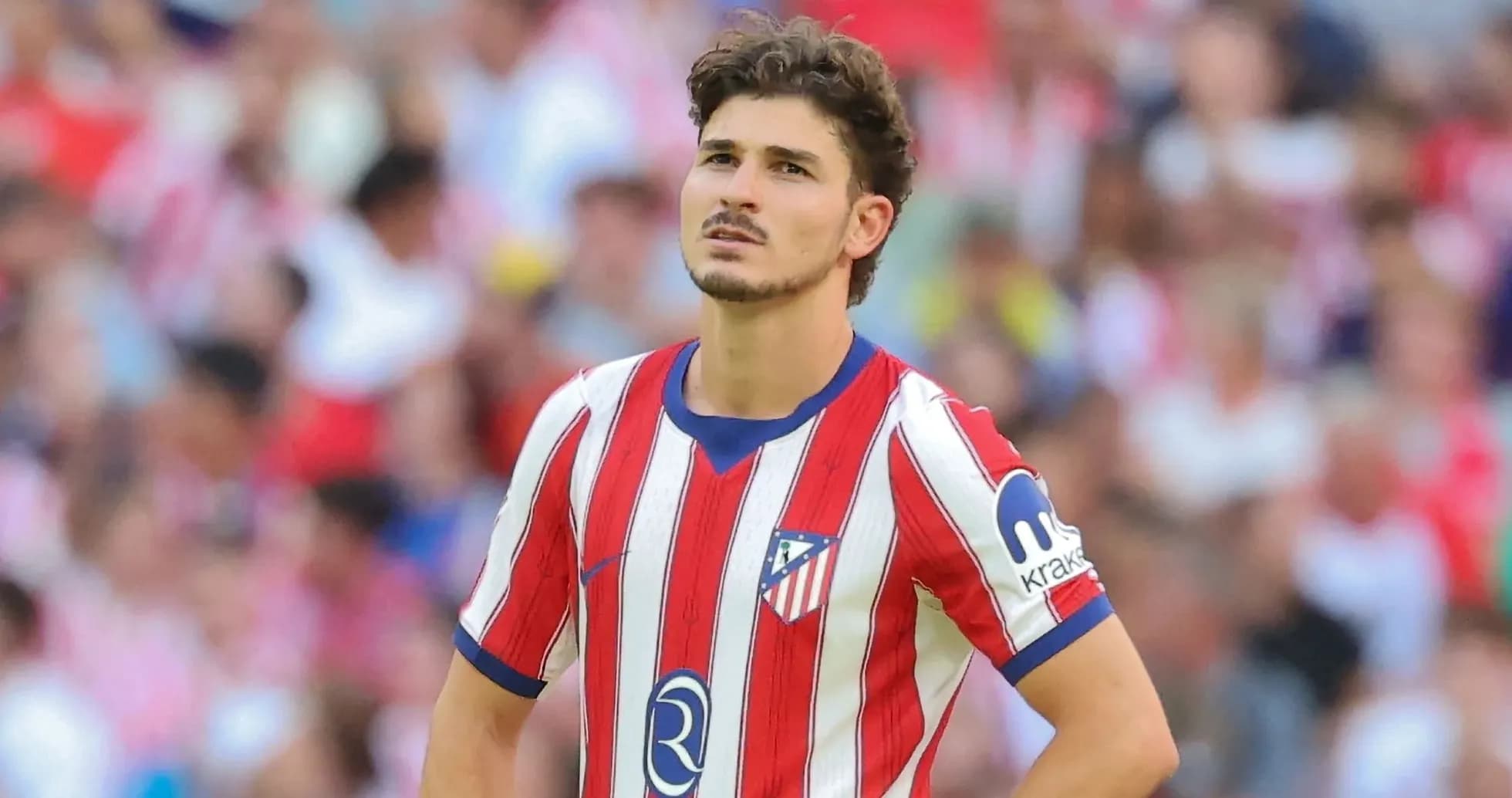 Atletico Madrid player looking up during match