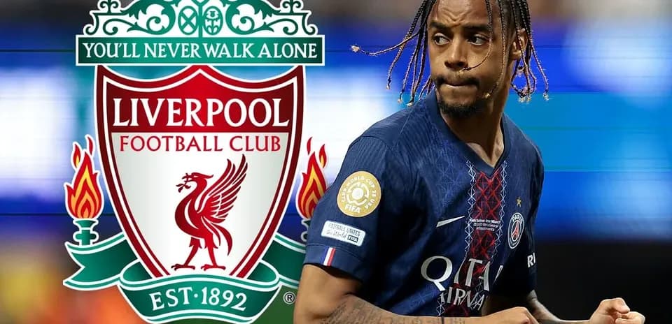 Player in PSG jersey running with Liverpool logo background