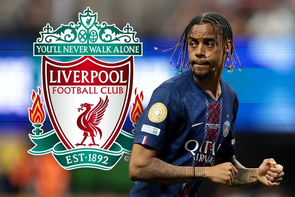 Player in PSG jersey running with Liverpool logo background