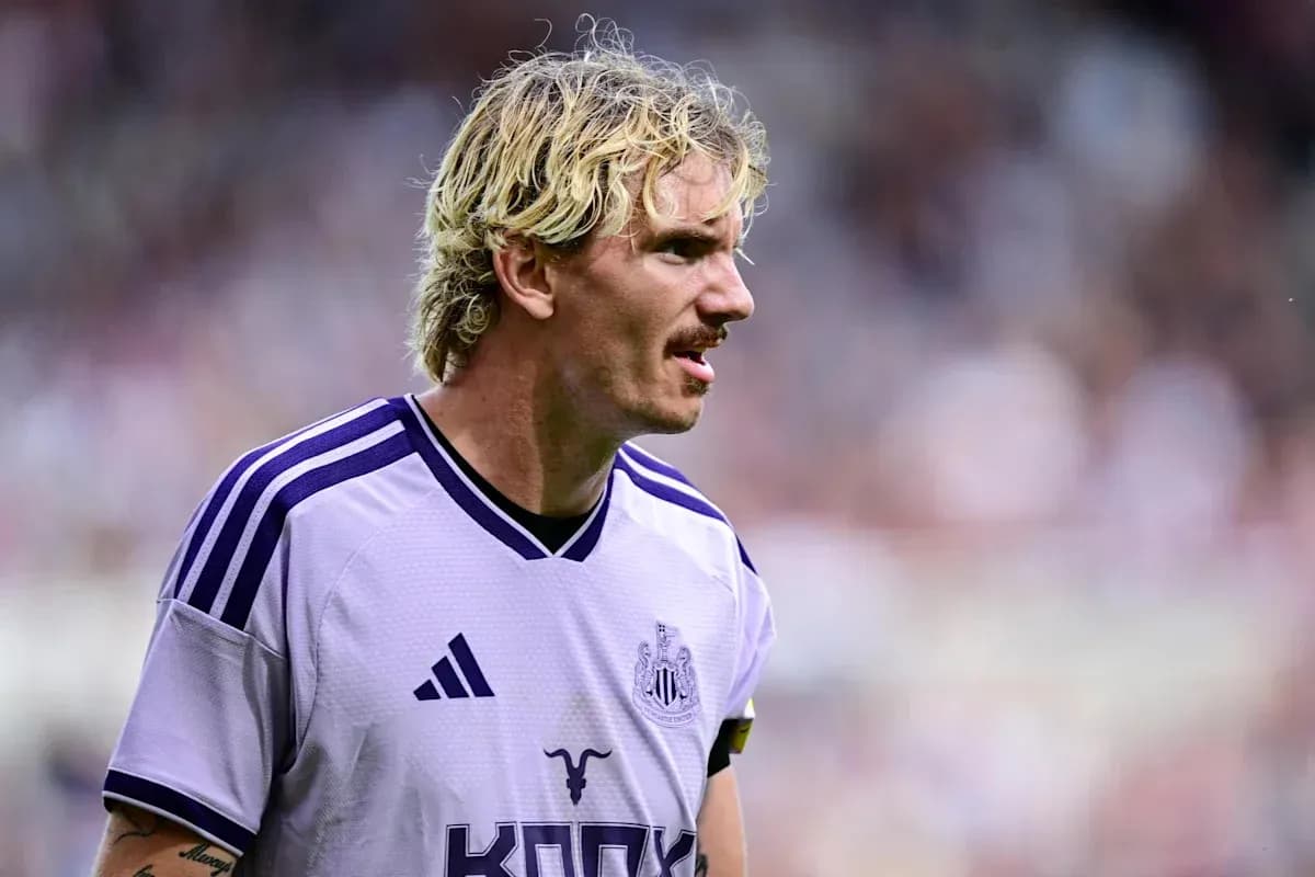 Newcastle player in purple kit on the field