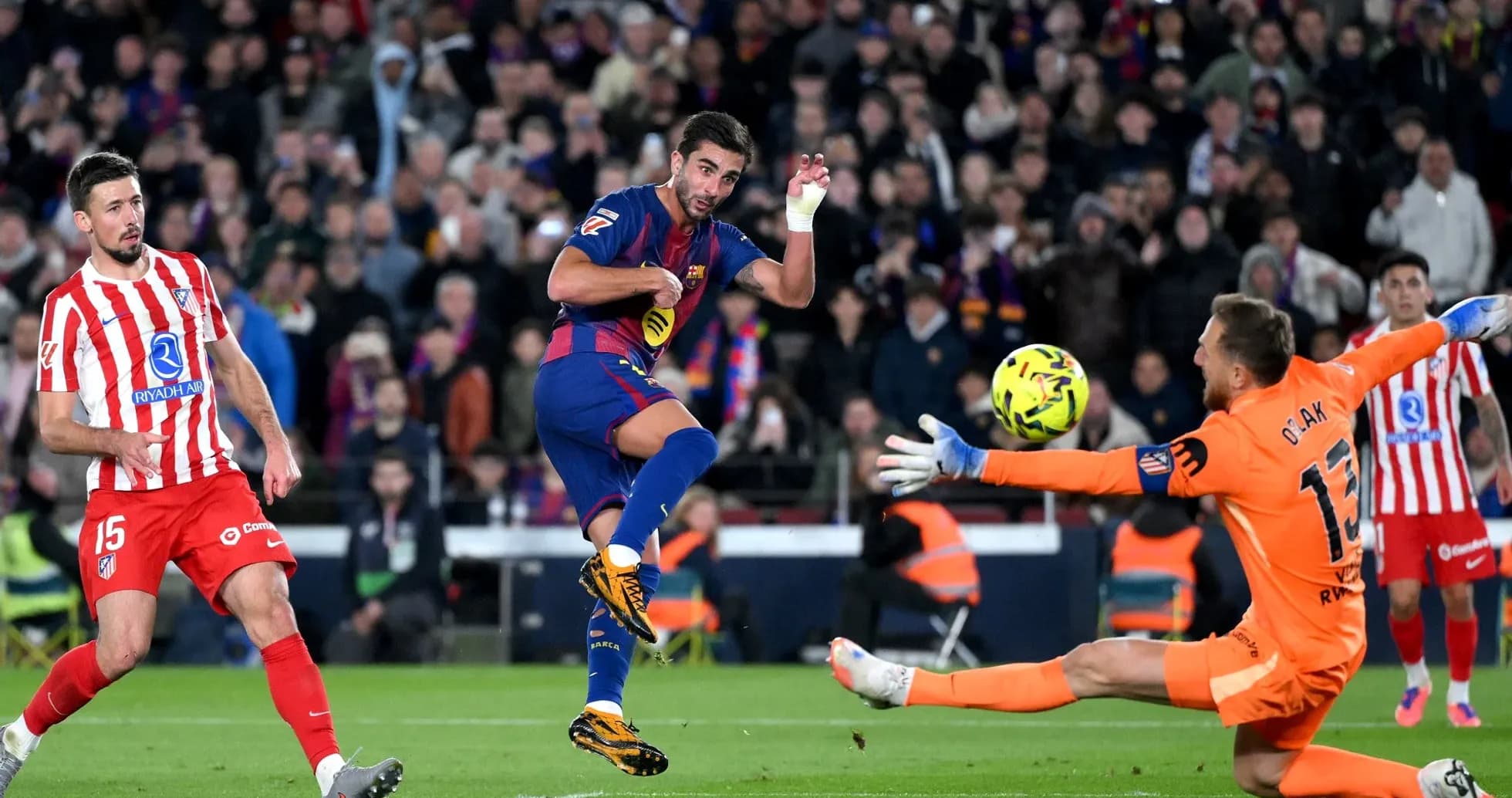 Barcelona player attempts to score against Atletico Madrid