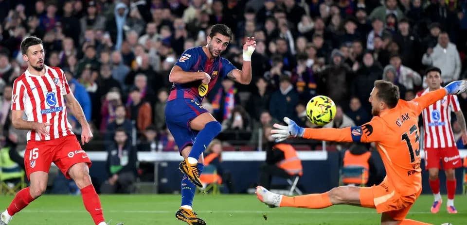 Barcelona player attempts to score against Atletico Madrid