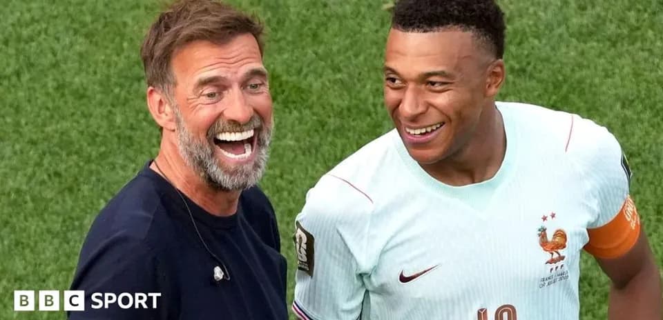 Manager and player smiling during match interaction