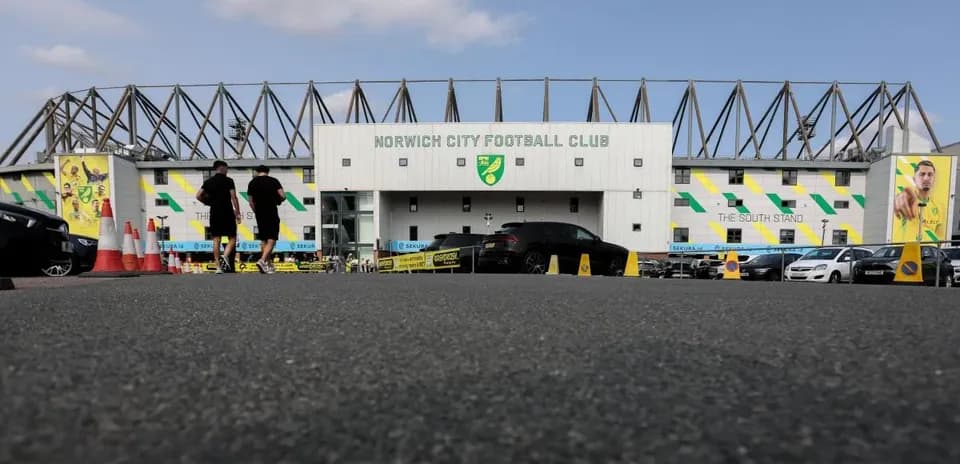 Norwich City Football Club entrance with fans arriving