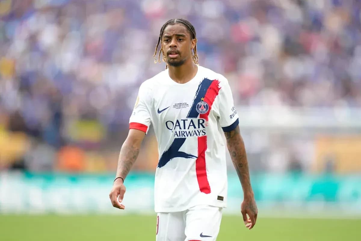 Player in PSG jersey walking on the field