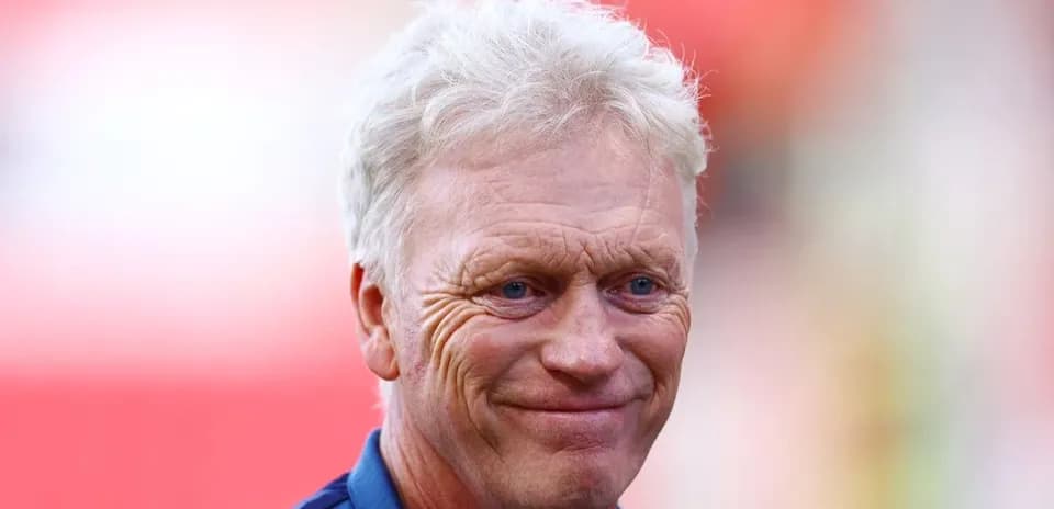 Coach smiling before the match at stadium