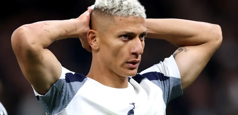 Player holding head during match frustration