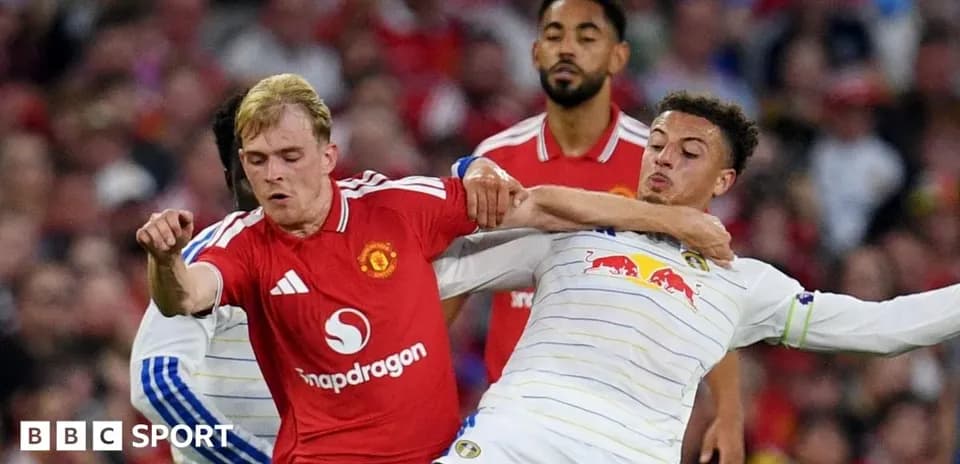 Players contesting the ball during a football match