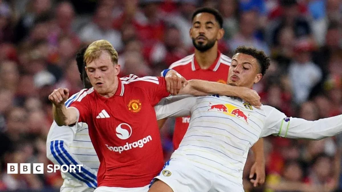 Players contesting the ball during a football match