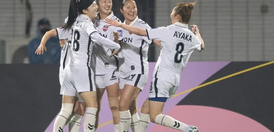 Players celebrating a goal in WK-League match