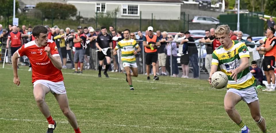 Player in green and yellow receiving ball during match