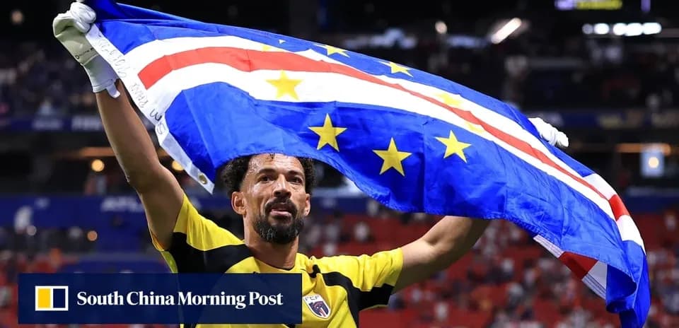 Goalkeeper celebrating with national flag after match
