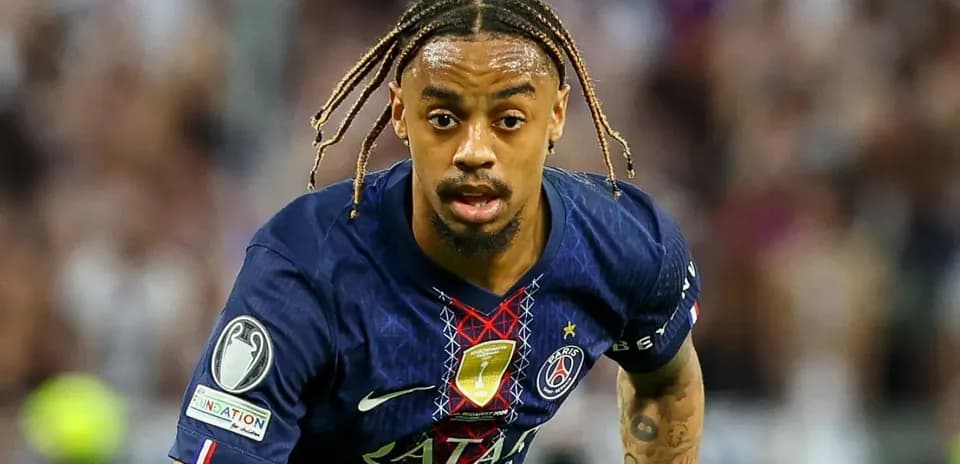 Player in PSG jersey sprinting on the field