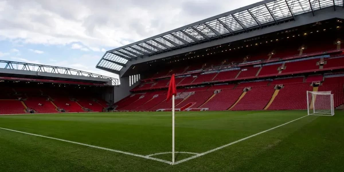 Corner flag at Anfield stadium with empty stands Corner flag at Anfield stadium with empty stands