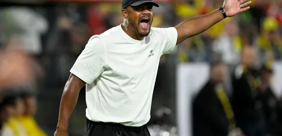 Coach gesturing during a match from the sideline